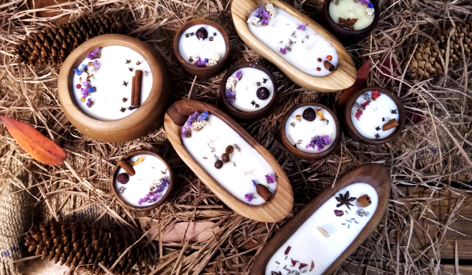 A display of candles with aroma and spices in beautiful wood container from Arbor